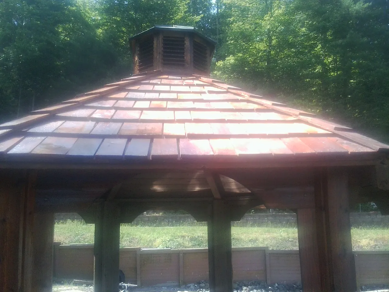 New cedar shake roof and cupola on a lakeside gazebo in Iona